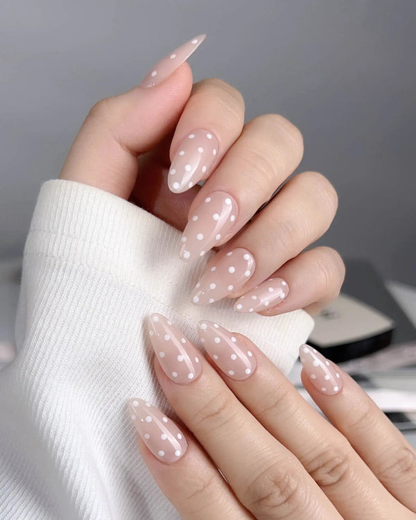 Short nude nails with soft dot design	