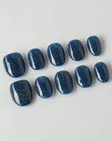 Glitter Glitz Navy press-on nails in extra short oval shape — deep blue cat eye glitter nails