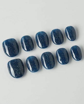 Glitter Glitz Navy press-on nails in extra short oval shape — deep blue cat eye glitter nails