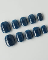 Glitter Glitz Navy press-on nails in extra short squoval shape — deep blue cat eye glitter nails