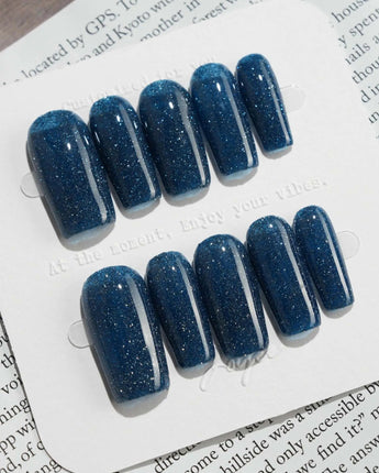 Glitter Glitz Navy press-on nails in medium square shape — deep blue cat eye glitter nails