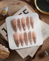 Solar Cycle nails in long stiletto — Icy Nude Pink &