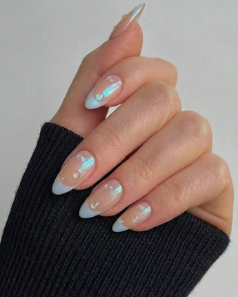 Close-up of Sparkling Wine showing mirror-like blue chrome French tip shine