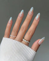Sparkling Wine short almond nails with glossy blue chrome tips for holiday looks