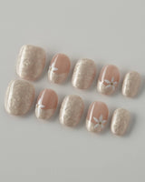 Spiral Twist in extra short oval shape with pearly nude silk texture and daisy details