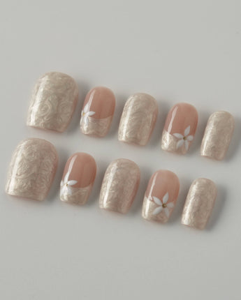 Spiral Twist in extra short square shape with silk nude texture and daisy accents