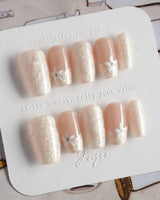 Spiral Twist in short coffin shape with pearl nude finish and daisy nail art
