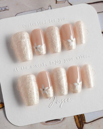 Spiral Twist in short coffin shape with pearl nude finish and daisy nail art