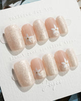 Spiral Twist in short square shape with pearl nude texture and daisy accent art