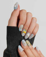 Splash Club mismatched pool day nails with bunny, duckling, bear, and chick scenes