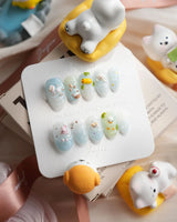 Splash Club handmade animal press-on nails with bunny, duckling, bear, and chick charms