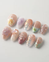Wonderland Whims spring nails with soft pastel pink, raised flowers, and glossy pearl details