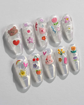 Squishy Pop long coffin nails with playful decals and glossy handmade finish