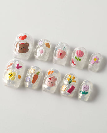 Squishy Pop short square nails with playful decals and glossy gel texture