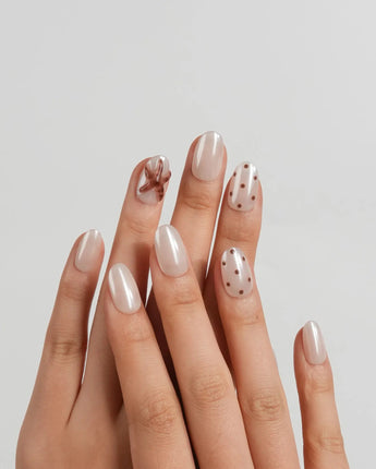 Starfish & Dots short oval press-on nails with translucent brown starfish accents