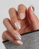 Starfish & Dots short oval nails with chocolate polka dots and tortoiseshell starfish