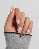 Starfish & Dots warm ivory nails with chocolate dots and designer-boutique starfish