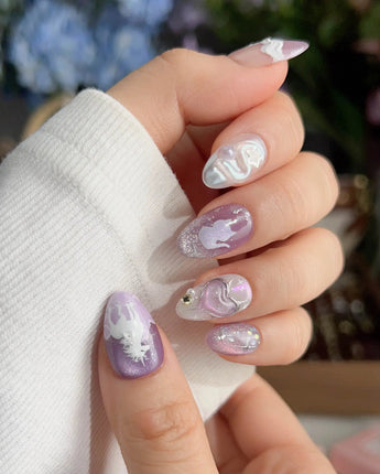 Stargaze extra short almond nails with pastel star details and sculpted dreamlike accents