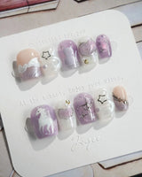 Stargaze handmade nails with pastel steps, star wishes, and glossy lavender gel polish