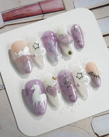 Stargaze extra short almond nails with lavender cat-eye finish and whimsical charm details