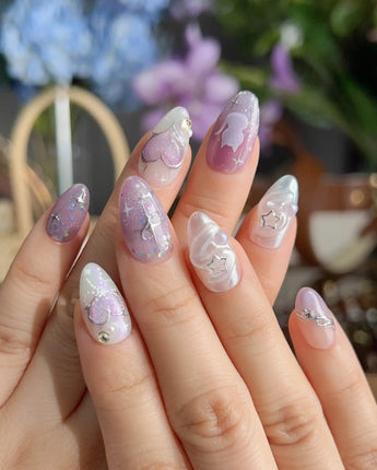 Stargaze handmade press-on nails with skyward steps, heart charms, and soft colorful accents