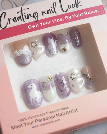 Stargaze close-up of colorful dream nails with 3D hearts, stars, and cat-eye shine