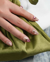 Crystal Berry press-on nails with burgundy red cat-eye shine and gold outlined cherry nail art