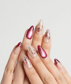 Sugar Thorn press-on nails with rose red French tips and sculpted metallic floral accents