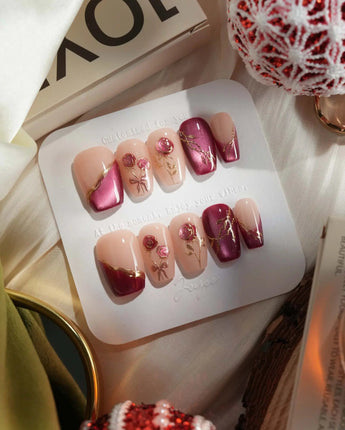 Sugar Thorn press-on nails with rose red gel, sculpted metallic florals and glossy tips