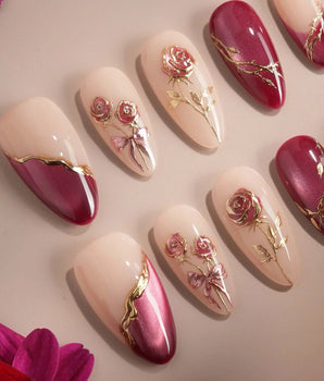 Sugar Thorn handmade press-on nails featuring Classic Rose Red, 3D Metallic Rose Reliefs & Contrast French Tips.