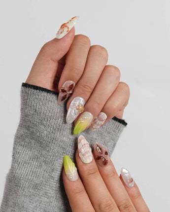 Sun Fossil glossy 3D ocean nails with natural shell gradients and pearl highlights
