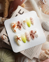 Sun Fossil beach nail set with sculpted crabs, starfish and sand dollar details