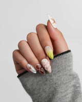 Sun Fossil warm beach press-on nails with sculpted sea charms and sandy tones