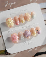 Sunbathing summer OOTD nails with pastel chrome, florals, and shell texture