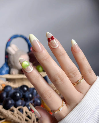 Sunny Mix close-up of 3D mixed fruits on nude French press-on nails