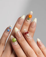 Sunny Mix nude French fruit nails with lemon yellow, peach and berry accents