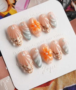 Sunset Shore handmade press-on nails featuring Nude & Orange, 3D Sculpted Flowers & Shells