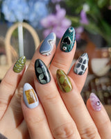 Mindbend futuristic nails with abstract 3D forms, earthy colors, and chrome highlights