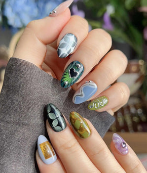 Mindbend abstract retro nails with green grid pattern, shifting shapes, and sculpted chrome detail