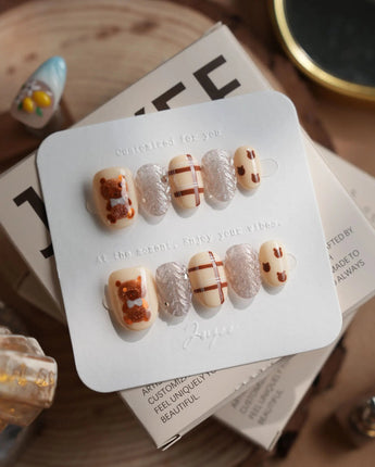 Sweater Weather press-on nails in extra short oval shape — Soft Brown Tone, 3D Bears & Knit Texture.