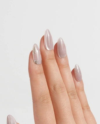 Sweet Nothings press-on nails in short almond shape — Soft Nude Pink, Glitter Accents, Metal Heart & Silver Flowers.