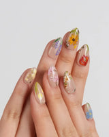 The Botanist handmade press-on nails featuring Vibrant Secret Garden, Multi-colored Hand-painted Florals & Metallic Edging.