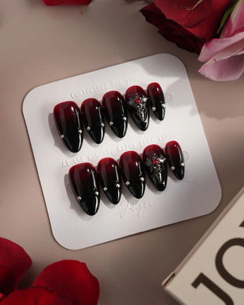 The Curse press-on nails — red to black gradient glossy chrome studs gothic cross charm handmade nail art by Joyee Nails