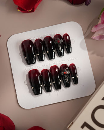 The Curse press-on nails — red to black gradient glossy chrome studs gothic cross charm handmade nail art by Joyee Nails