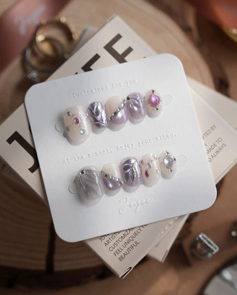 The Cygnus press-on nails — silver lilac cat eye feather chrome rhinestone cat eye effect handmade nail art by Joyee Nails
