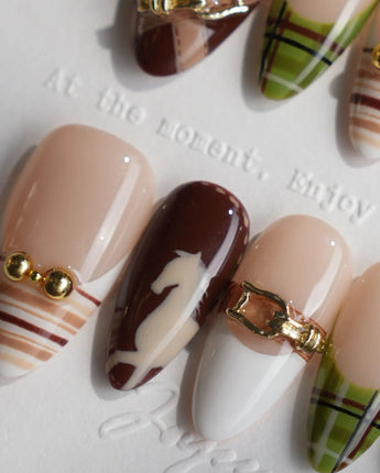THE HEIR medium almond press-on nails with burgundy plaid, gold details and horsebit accents