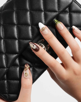THE HEIR medium almond press-on nails with vintage plaid and metallic horsebit nail art