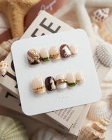 THE HEIR extra short squoval press-on nails with vintage plaid and metallic horsebit accents