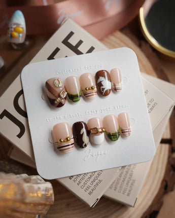 THE HEIR short oval press-on nails with vintage plaid and equestrian horsebit accents