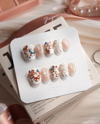 THE REVERIE extra short oval nails with pearl 3D swirls and dreamy carousel styling